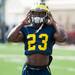 Michigan wide receiver Dennis Norfleet puts on his helmet  during a warm up on the practice field outside of the Al Glick Field House on Thursday, August 8, 2013. 
Courtney Sacco I AnnArbor.com