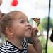 Mackenzie Dunsmore, age 3, holds a painted lady butterfly from the Michigan Native Butterfly Farm at the Ypsilanti Heritage Festival, Saturday, August, 17.
Courtney Sacco I AnnArbor.com 