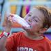Aaron Fleming, age six, bites into some cotton candy at the Chelsea Community Fair in Chelsea, Friday, August, 23.Courtney Sacco I AnnArbor.com