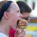 Vashti Fleming, age 11, bites into a candy apple at the Chelsea Community Fair in Chelsea, Friday, August, 23.Courtney Sacco I AnnArbor.com