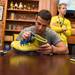 Former Wolverines basketball player Josh Bartelstein signs an autograph at the MDen in Ann Arbor, Saturday, August, 24.
Courtney Sacco I AnnArbor.com   