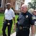 Executive director of UM's Division of Public Safety and Security Eddie L. Washington Jr. and University of Michigan Police Chief Joe Piersante walk house to house on Hill Street during a outreach program run by Beyond the Diag, Thursday, Aug, 29.
Courtney Sacco I AnnArbor.com  