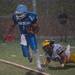 Skyline quarterback Askaree Crawford runs the ball in the rain having dogged a tackle from Hartland's Nathan Smith during the second quarter of their game, Thursday, Aug. 29.
Courtney Sacco I AnnArbor.com  
