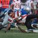 Belleville's running back Antwane McGuiredodges a tackle form Lincoln's defense during the first quarter of their game at Lincoln High School, Friday, Aug, 30.
Courtney Sacco I AnnArbor.com    
