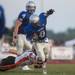 The Railsplitters running back Cam Williams is tackled by Belleville's Drew Priebe  as he runs the ball  during the second quarter of their game at Lincoln High School, Friday, Aug, 30.
Courtney Sacco I AnnArbor.com    