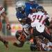 The Railsplitters Dalauren Roberson is tackled by the Belleville defense as he runs the ball during the second quarter of their game against Belleville at Lincoln High School, Friday, Aug, 30.
Courtney Sacco I AnnArbor.com    