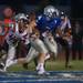 The Railsplitters quarterback Eugene Smith runs the ball after faking a fakes a hand off during the third quarter of their game against Belleville at Lincoln High School, Friday, Aug, 30.
Courtney Sacco I AnnArbor.com    