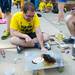 Ethan Stark, a first year Ph.D. student, cooks up pancakes using a makeshift stove as he waits in line for the Michigan  student section queue to open.
Courtney Sacco I AnnArbor.com 