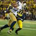 Michigan defensive back Blake Countess tackles Notre Dame's Amir Carlisle during the second quarter of their game at Michigan Stadium, Saturday, Sept. 7. 
Courtney Sacco I AnnArbor.com 