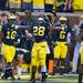 Running back Fitzgerald Toussaint throws his arms in the air as the crowed cheers before before the start of their game against Notre Dame at Michigan Stadium, Saturday, Sept. 7. 
Courtney Sacco I AnnArbor.com 