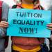 Protesters demanding tuition equality for unauthorized immigrants chant as they stand in the intersection of South State Street and South University Avenue in Ann Arbor. 
Courtney Sacco I AnnArbor.com