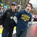 A University of Michigan police officer arrests a protester for sitting in the intersection of South State Street and South University Avenue in Ann Arbor. The protesters were demanding tuition equality for unauthorized immigrants.
Courtney Sacco I AnnArbor.com