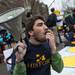 A protester chants as he sits in the intersection of South State Street and South University Avenue in Ann Arbor demanding tuition equality for unauthorized immigrants.
Courtney Sacco I AnnArbor.com
