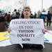 A protester sits in the intersection of South State Street and South University Avenue in Ann Arbor demanding tuition equality for unauthorized immigrants.
Courtney Sacco I AnnArbor.com