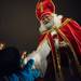 St. Nicholas hands out chocolate coins to the children in Kerrytown at the Farmers Market during this years Midnight Madness in Ann Arbor.
Courtney Sacco I AnnArbor.com   
