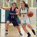 The Irish's Jessica Jenkins drives the ball down court against Pioneer's Elizabeth Fichera during Thursday evenings game at Father Gabriel Richard High School.Courtney Sacco I AnnArbor.com 