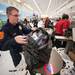 A Pittsfield firefighter bags up toys during this years shop with a hero event at Meijer.
Courtney Sacco I AnnArbor.com 