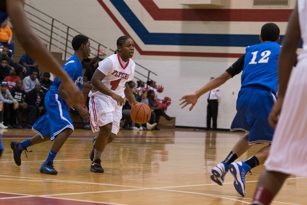 The Flyers DaQuanta Brown dribbles the ball down court during Friday nights game against Lincoln High School.
Courtney Sacco I AnnArbor.com 
