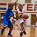 The Flyers Jaleel Neal drives the ball down court against Lincoln's Javin Etchison during Friday nights game at Willow Run High School.
Courtney Sacco I AnnArbor.com 