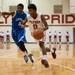 The Flyers Greg Gardner drives the ball down court against Lincoln's Gary Chambers during Friday nights game at Willow Run High School.
Courtney Sacco I AnnArbor.com 