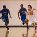 The Flyers Brett Smirh drives the ball down court against Lincoln's Mike McMullan and Javin Kilgo during Friday nights game at Willow Run High School.
Courtney Sacco I AnnArbor.com 