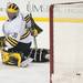 The Wolverines goalie Adam Janecyk looks back as the Falcons 4th goal enters his net, Tuesday Jan. 8. 
Courtney Sacco I AnnArbor.com 