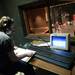 Stage Manager Eleanor Howell-Shryock sits in the lighting booth as the cast of "The Musical Comedy Murders of 1940" sets up for dress rehearsal, Wednesday, Jan. 16.
Courtney Sacco I AnnArbor.com   
