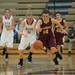 Dexter's Riley McDonald and Manchester's Jessie Manders both run after a loos ball during Tuesday nights in Dexter.
Courtney Sacco I AnnArbor.com 