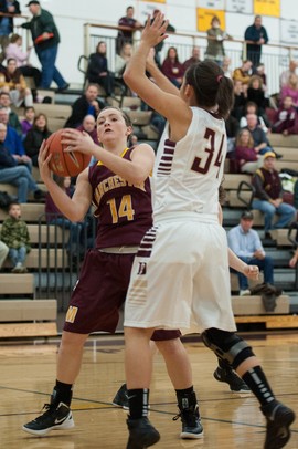 Manchester's Jessie Manders shoots the ball against Dexter's Teia McGahey during Tuesday nights in Dexter.
Courtney Sacco I AnnArbor.com