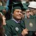 An undergraduate holds up his diploma after receiving it during EMU's 2012 winter commencement.
Courtney Sacco I AnnArbor.com  