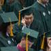 An undergraduate student makes a phone call as he waits for the start of EMU's 2012 winter commencement.
Courtney Sacco I AnnArbor.com  
