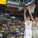 Wolverines freshman Mitch McGary tries to make a basket against EMU's Austin Harper during Thursday nights game.Courtney Sacco I AnnArbor.com  