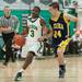 Huron's Ernest Johnson drives the ball down court during Friday nights game against Chelsea.
Courtney Sacco I AnnArbor.com 