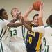 Chelsea's Scott Crews tries to keep the ball form three Huron players during Friday nights game at Huron High School. 
Courtney Sacco I AnnArbor.com 