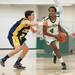 Huron's Chris Mosley drives the ball down court during Friday nights game against Chelsea.
Courtney Sacco I AnnArbor.com 