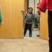 Sneaking a peek through an open door, 4-year-old Kalei Jackson tries to get a glimpse at the presents.
Courtney Sacco I AnnArbor.com 