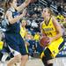 Wolverines Rachel Sheffer tries to make a jump shot against Lady Lions Tori Waldner, Monday, Jan. 21.

Courtney Sacco I AnnArbor.com 