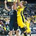 Wolverines Rachel Sheffer tries to make a jump shot against Lady Lions Tori Waldner, Monday, Jan. 21.

Courtney Sacco I AnnArbor.com 