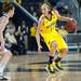 Wolverines Nicole Elmblad dribbles the ball as she is guarded by lady Lions Meggie Lucas, Monday, Jan. 21.

Courtney Sacco I AnnArbor.com 