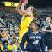 Wolverines Nicole Elmblad makes a jump shot during the second half of their game against the Lady Lions Monday, Jan. 21.

Courtney Sacco I AnnArbor.com 