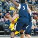 Wolverines Jenny Ryan tires to make a jump shot as she is guarded by by two Lady Lions during the second half of there game Monday, Jan. 21.

Courtney Sacco I AnnArbor.com 
