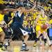 Wolverines Kate Thompson looks for an open team mate during the second half of their game against the Lady Lions Monday, Jan. 21.

Courtney Sacco I AnnArbor.com 