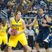 Wolverines Nicole Elmblad guarded by three Lady Lions after making a rebound during the second half of their game Monday, Jan. 21.

Courtney Sacco I AnnArbor.com 