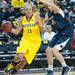 Wolverines Sam Arnold guarded by Lay Lions tori Waldner during the first half of their game Monday, Jan. 21.

Courtney Sacco I AnnArbor.com 