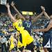 Wolverines Rachel Sheffer and Lady Lions NikkI Greene reach for a rebound during the first half of their game Monday, Jan. 21.

Courtney Sacco I AnnArbor.com 