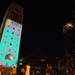 Onlookers watch as people play Superhero as it is projected onto The Burton Memorial Tower at Top of the Park Friday.
Courtney Sacco I AnnArbor.com