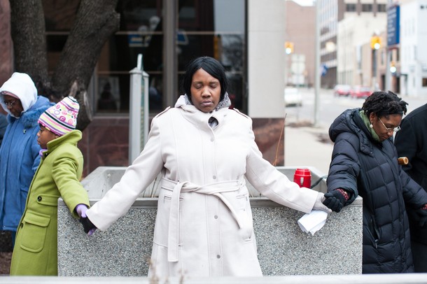 Marchers hold hands and bow their heads as they say a prayer before the start of the MLK Day Unity Walk in Ann Arbor Sunday, Jan 13.
Courtney Sacco I AnnArbor.com 