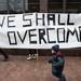 Marchers cary a sine that reads "We shall overcome" as they march down South Main St. in Ann Arbor during the MLK Day Unity Walk in Sunday, Jan 13.
Courtney Sacco I AnnArbor.com 