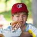 Seven-year-old Alex Uranga bites into a hot dog during the ceremonial grand reopening of Veterans Memorial Park, Sunday, August 4.
Courtney Sacco I AnnArbor.com  