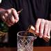 Alley Bar bartender David Martinez pours Jameson into a cup to begin making a "Top O' the Morning to Ya" drink on Tuesday, June 18. Daniel Brenner I AnnArbor.com